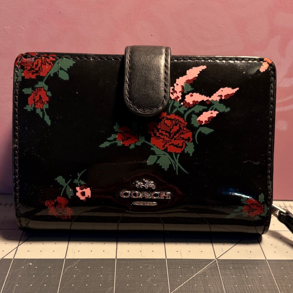 Coach black patent leather wallet with floral print